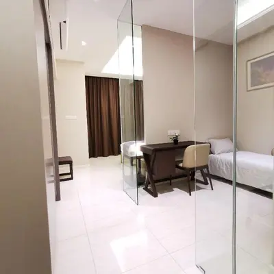 a room with a desk and a bed and a table at SKY POOL Luxury Suite 2-4Pax at KL City in Kuala Lumpur