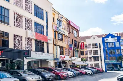a row of cars parked in front of buildings at OYO 89652 Bjorn Boutique Hotel in Kuala Lumpur