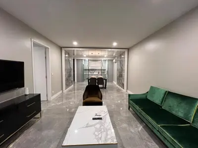 a living room with a couch and a tv at The Platinum KLCC 2 in Kuala Lumpur