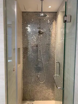 a shower with a glass door in a bathroom at Star Residences KLCC in Kuala Lumpur