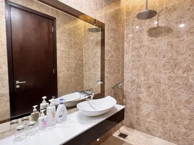 a bathroom with a sink and a shower at Dorsett Residences Bukit Bintang in Kuala Lumpur