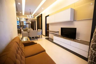 a living room with a couch and a flat screen tv at Dorsett Residences Bukit Bintang in Kuala Lumpur