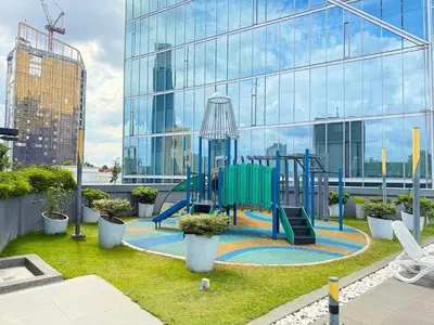 a playground in front of a glass building at Dorsett Residences Bukit Bintang in Kuala Lumpur