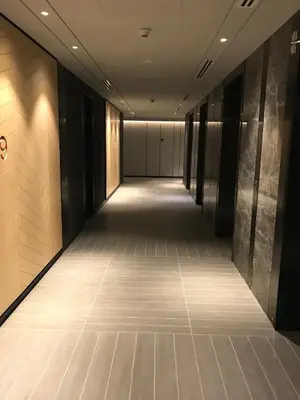 an empty corridor in a building with black walls at Tropicana The Residence, KLCC in Kuala Lumpur