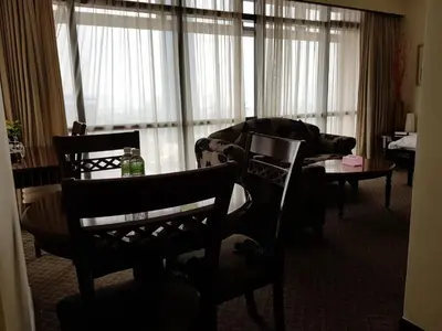 a living room with a couch and a table at New Town Suite At Times Square in Kuala Lumpur