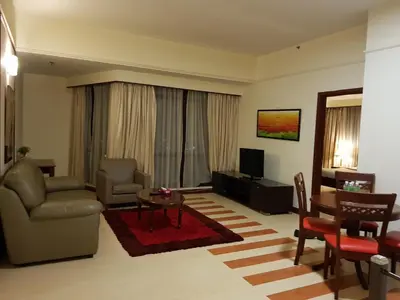 a living room with a couch and a table at New Town Suite At Times Square in Kuala Lumpur