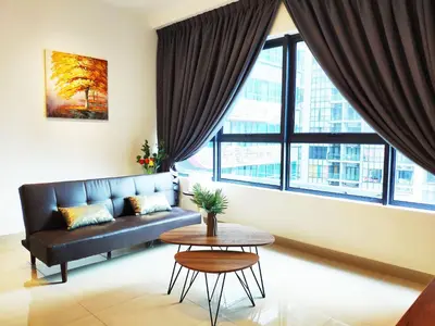 a living room with a couch and a table at Arte Plus - Family Suite, 5 pax, Jalan Ampang in Kuala Lumpur