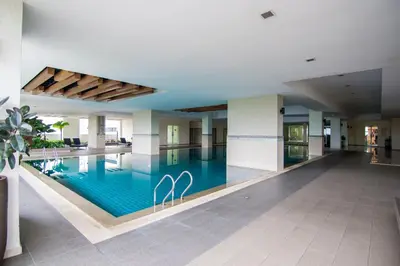 a swimming pool in the middle of a building at 231TR by Plush in Kuala Lumpur