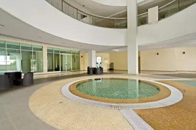 a large pool in the middle of a building at 231TR by Plush in Kuala Lumpur