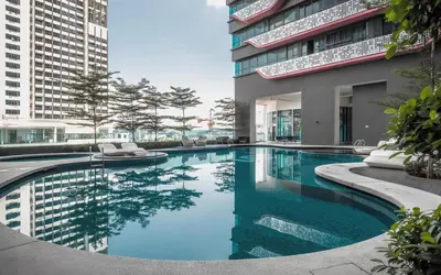 a swimming pool in the middle of a building at Arte Plus Kuala Lumpur in Kuala Lumpur