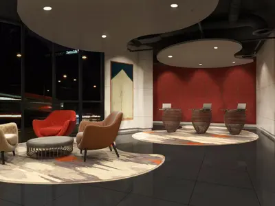 a lobby with chairs and tables in a building at J-Hotel by Dorsett in Kuala Lumpur