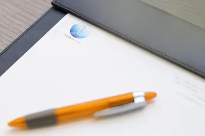 a pen sitting next to a notebook with a pencil at J-Hotel by Dorsett in Kuala Lumpur