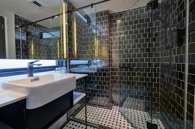 a bathroom with a sink and a shower at J-Hotel by Dorsett in Kuala Lumpur