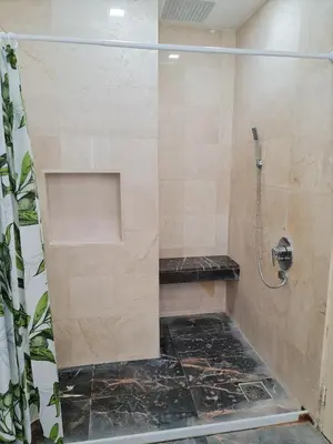 a bathroom with a shower with a glass door at Bukit Bintang Apartment by Sarah's Lodge @ Fahrenheit88 in Kuala Lumpur
