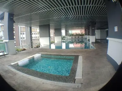 a large pool in the middle of a building at VUE RESIDENCE SERVICE SUITE - Studio 3 pax in Kuala Lumpur
