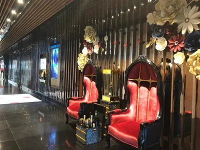 two red chairs in a room with a wall at La Platinum KLCC in Kuala Lumpur