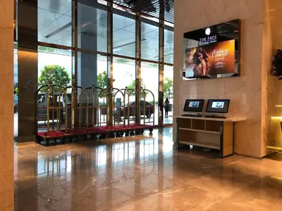 a lobby with a television in a building at La Platinum KLCC in Kuala Lumpur