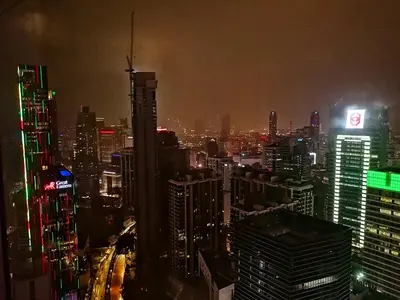 a view of a city at night with buildings at Yemala Suites at Vortex KLCC in Kuala Lumpur