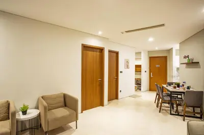 a living room with a dining room table and chairs at Yemala Suites at Vortex KLCC in Kuala Lumpur