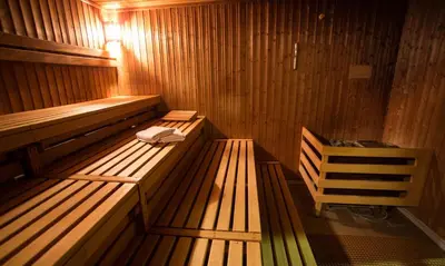 a sauna with two wooden benches in a room at Damai 88 by Moka near KLCC in Kuala Lumpur