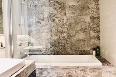 a bathroom with a tub and a sink at Damai 88 by Moka near KLCC in Kuala Lumpur