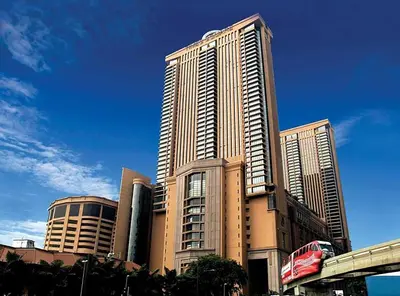 a large tall building with a bus in front of it at RJ Service Suite at Times Square in Kuala Lumpur