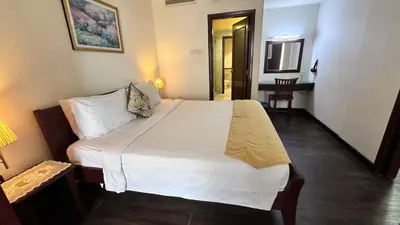 a bedroom with a large white bed in a room at Rihanna service suite at times square in Kuala Lumpur