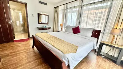 a bedroom with a large bed and a large window at Rihanna service suite at times square in Kuala Lumpur