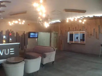 a living room with a couch and a tv and lights at VUE RESIDENCE SERVICE SUITE- 2 ROOMS SIZE 500SFT 4 pax in Kuala Lumpur