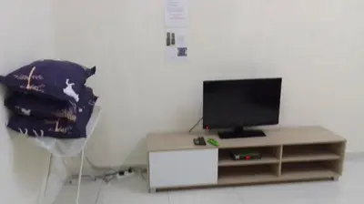 a television sitting on a stand in a room at VUE RESIDENCES Jln Pahang, KL city - 2 ROOM - 4 pax in Kuala Lumpur