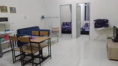 a room with chairs and a table and a couch at VUE RESIDENCES Jln Pahang, KL city - 2 ROOM - 4 pax in Kuala Lumpur