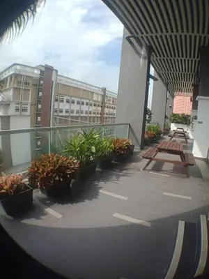 a view of a building with plants on a balcony at VUE RESIDENCES SERVICE SUITE 2 ROOMS DELUXE 6 Pax in Kuala Lumpur