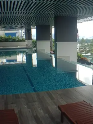 a large swimming pool in a building with a pool at VUE RESIDENCES SERVICE SUITE 2 ROOMS DELUXE 6 Pax in Kuala Lumpur