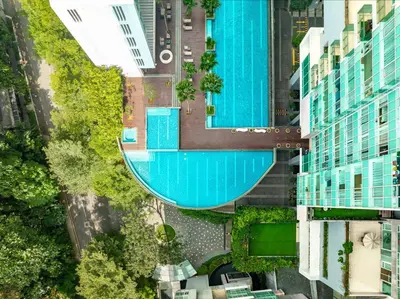 an overhead view of a swimming pool between buildings at Lanson Place Bukit Ceylon in Kuala Lumpur
