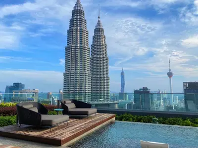a view of the petronas twin towers from a building at Like Home Star KLCC in Kuala Lumpur