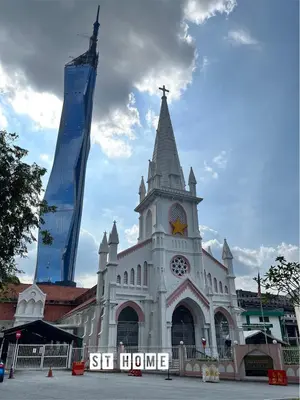 a large white church with a clock tower at Deluxe Swiss Garden Residences Bukit Bintang City Center in Kuala Lumpur