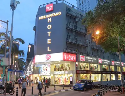 a building with a sign that says the arminders building at Bitz Bintang Hotel in Kuala Lumpur