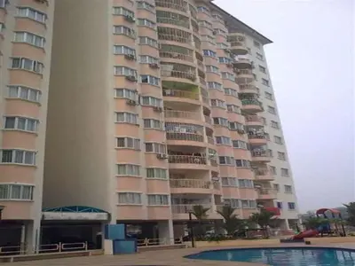 a large apartment building with a pool in front of it at UMMII Homestay in Ampang