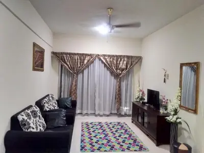 a living room with a couch and a window at UMMII Homestay in Ampang