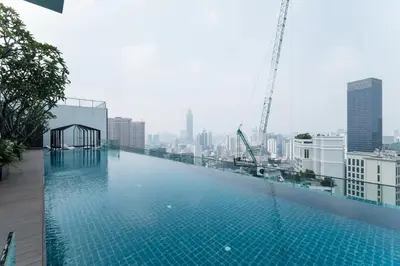 a large swimming pool on top of a building at TriBeCa 2bedroom 3min walk to bukit bintang 2 rooftop pool in Kuala Lumpur