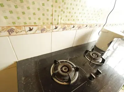 a kitchen counter with a stove top oven in a kitchen at Mahasa Homestay Kuala Lumpur in Kuala Lumpur