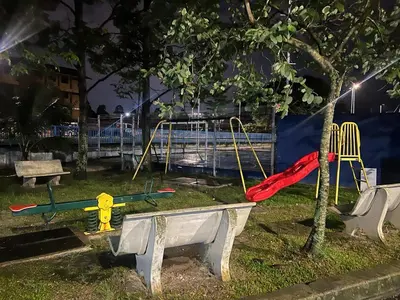 a park with a playground with surfboards on it at night at Mahasa Homestay Kuala Lumpur in Kuala Lumpur