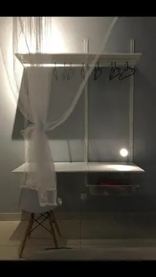 a room with a curtain and a shelf with a light at Cozy Studio 10min to KLCC next to Hospital Gleneagle Jalan Ampang in Kuala Lumpur
