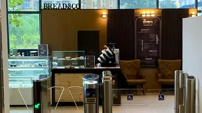 a restaurant with a counter and chairs in a room at 3 Towers 10min to KLCC next to Hospital Gleneagle in Kuala Lumpur