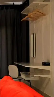 a bedroom with a bed and a white table and chair at 3 Towers 10min to KLCC next to Hospital Gleneagle in Kuala Lumpur