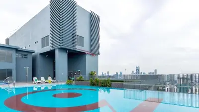 a swimming pool on the roof of a building at 3 Towers 10min to KLCC next to Hospital Gleneagle in Kuala Lumpur