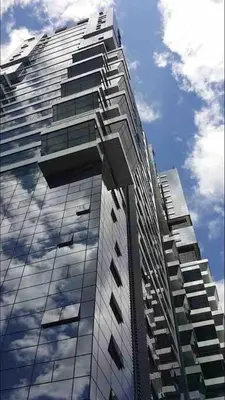 a tall building with a reflection of the sky at 3 Towers 10min to KLCC next to Hospital Gleneagle in Kuala Lumpur