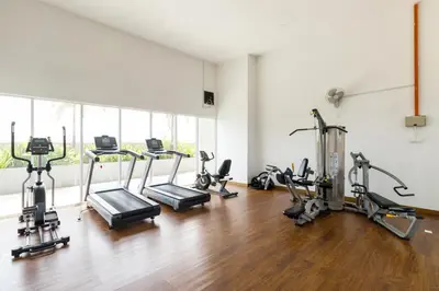 a gym with several treadmills and cardio machines at Boulevard Service Apartment KL by Airhost in Kuala Lumpur