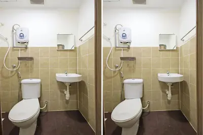 a bathroom with two toilets and two sinks at Hotel O Shalimar in Kuala Lumpur