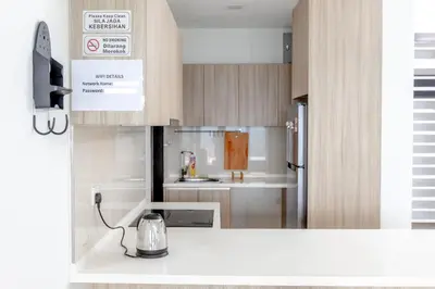 a kitchen with a tea kettle on a counter at Rex Ollie @ The Elements Ampang in Kuala Lumpur